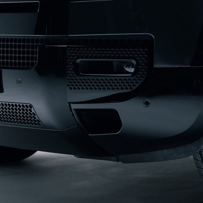 Gloss Black front bumper corner trim fitted to a Land Rover Defender 110
