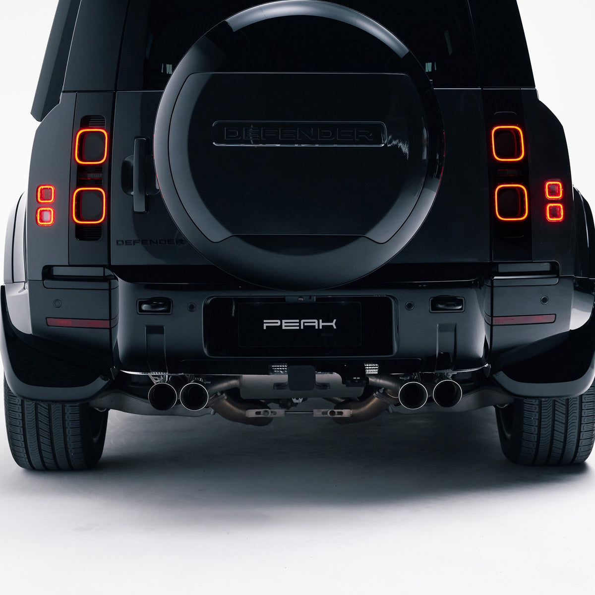 Gloss Black rear bumper trim fitted to a Land Rover Defender 110, rear view