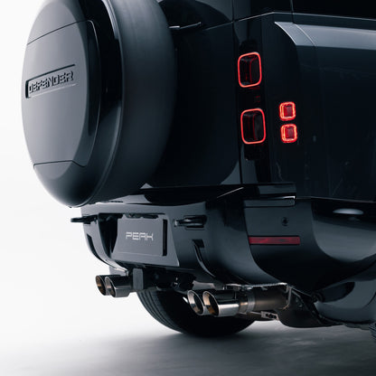 Gloss Black rear bumper trim on a Land Rover Defender 110, rear quarter view