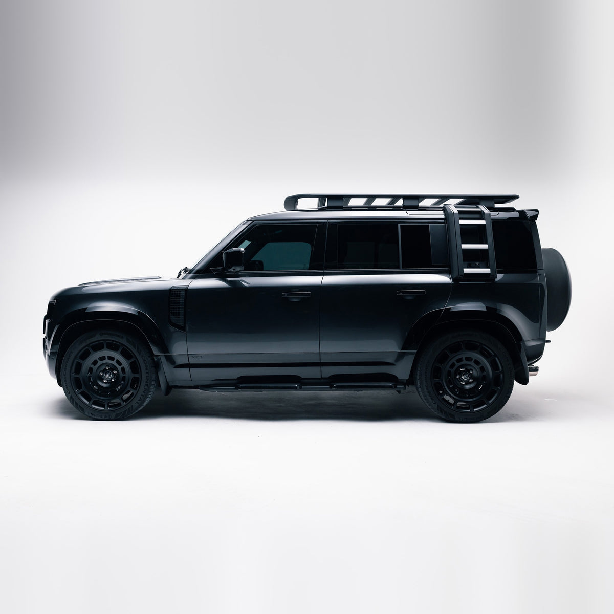 Land Rover Defender 110 side profile with Gloss Black door mouldings