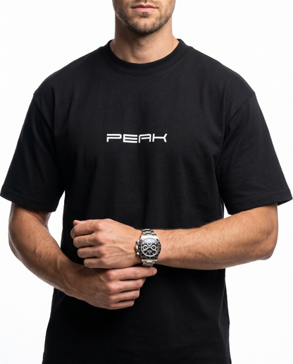 PEAK Heavy Tee in Black, close up of the PEAK wordmark and heavyweight cotton