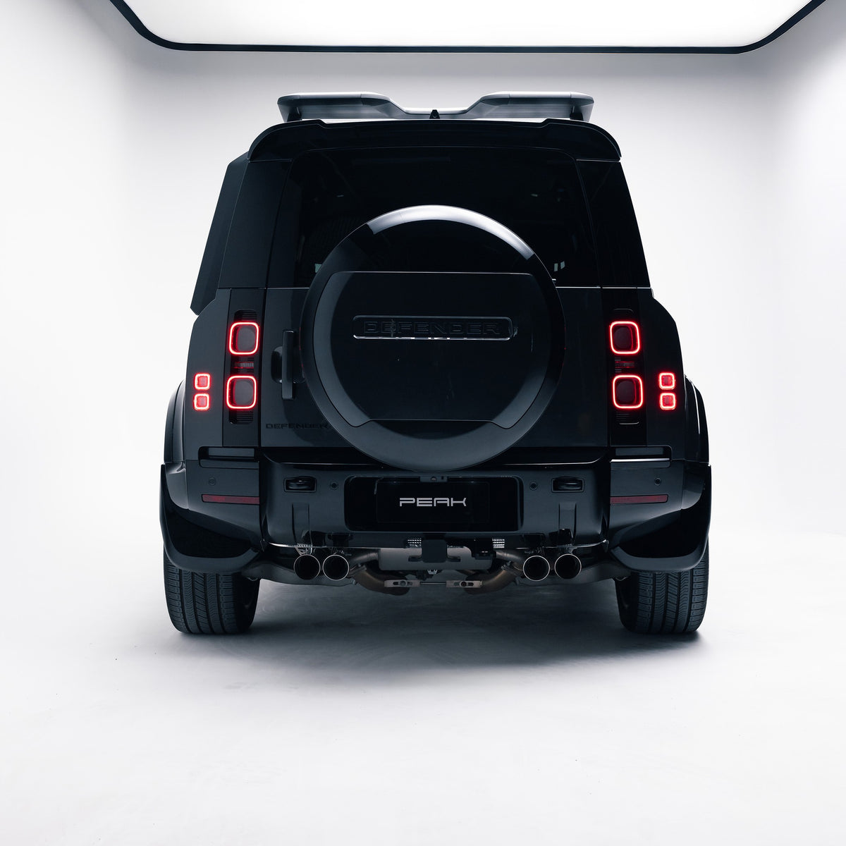 Land Rover Defender 110 rear view with Gloss Black spare wheel cover